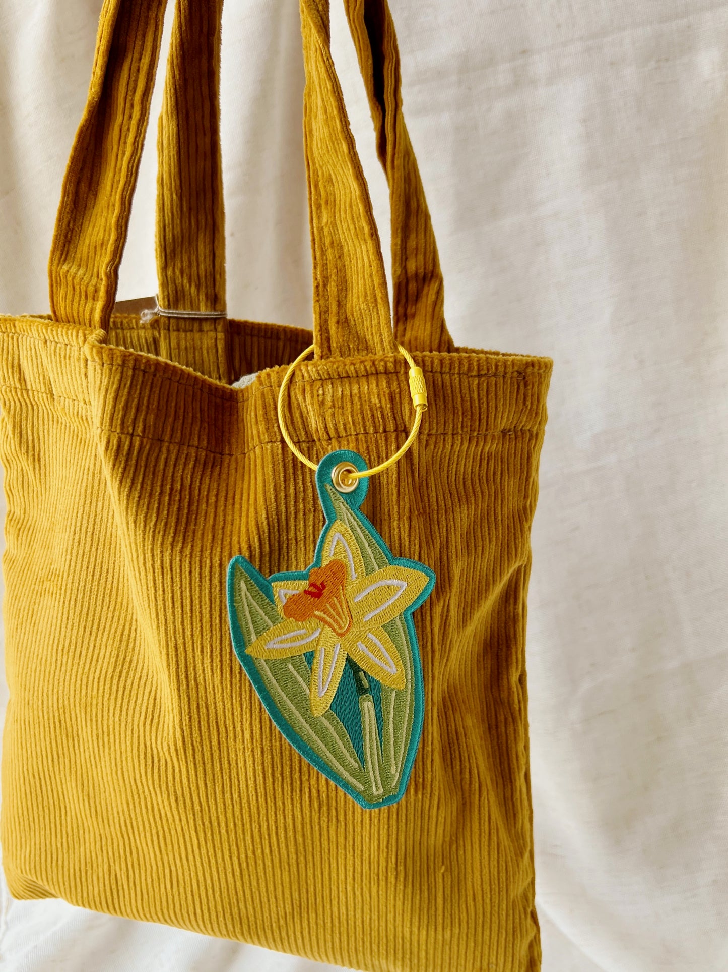 Daffodil embroidered bag charm keychain