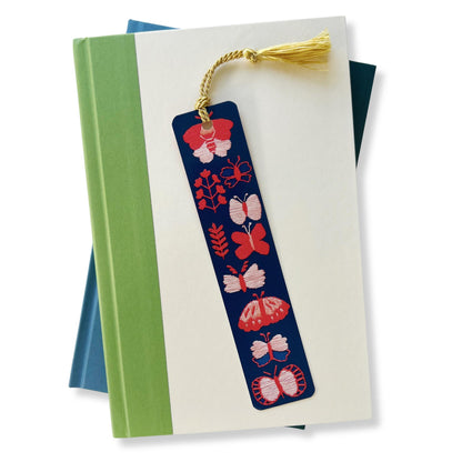 Dark blue bookmark with pink and red embroidered butterflies by Rikrack