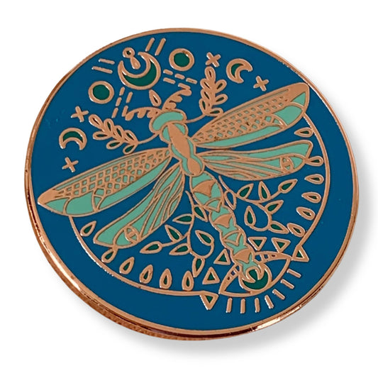 magnetic needle minder with dragon fly design on a blue background