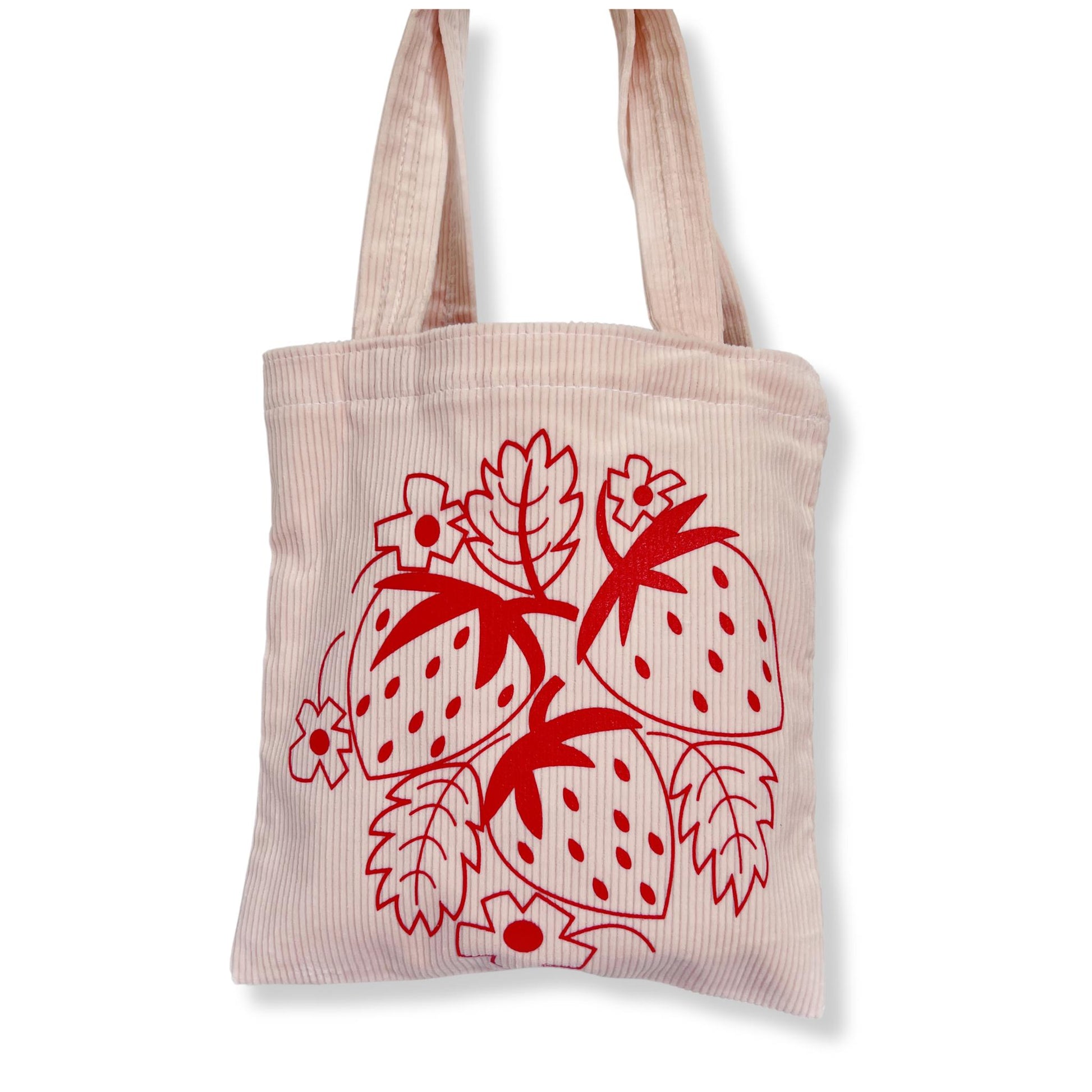 light pink corduroy tote bag with red strawberry silkscreened design