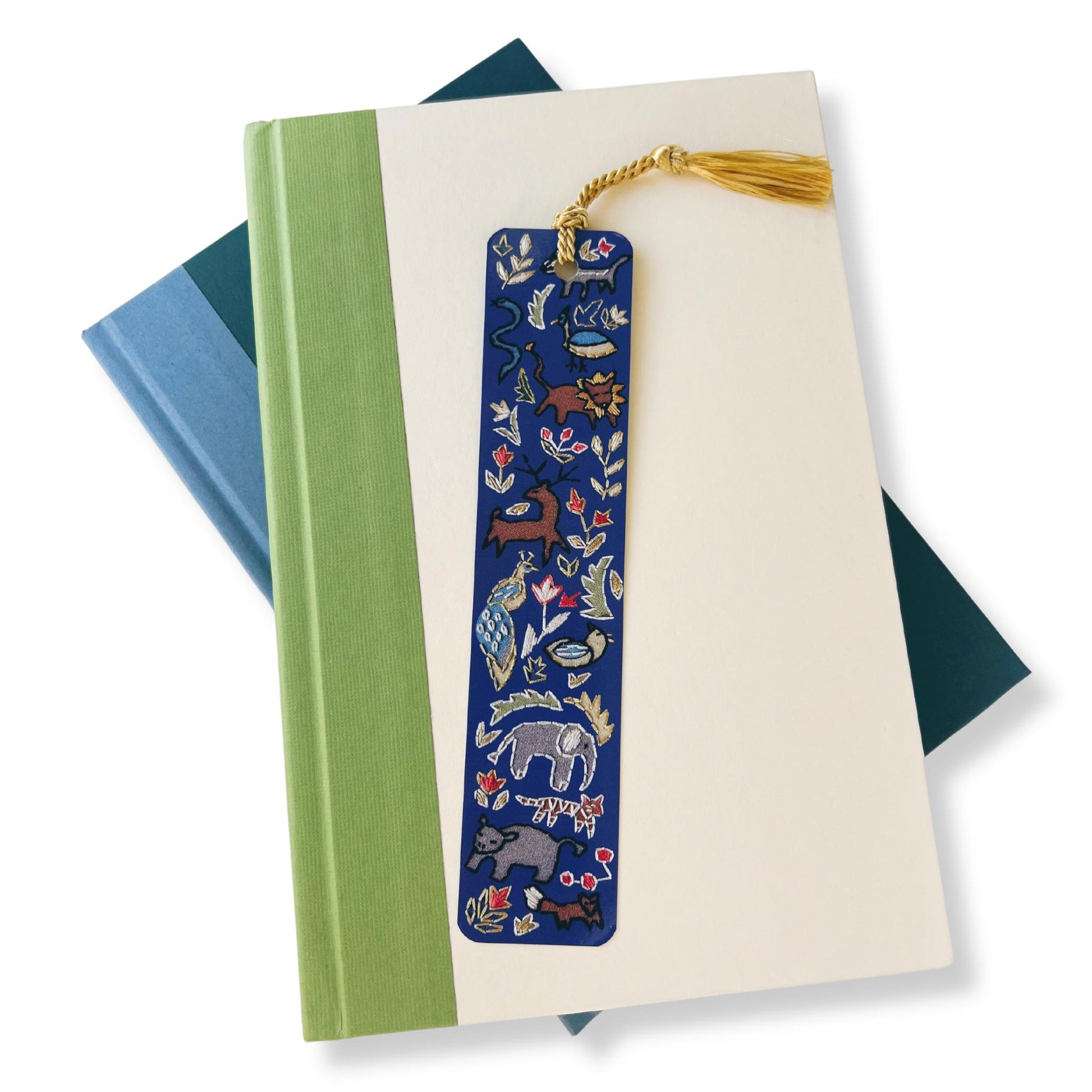 1.5x7 inch dark blue bookmark with realistic stitching of assorted wild animals including deer, elephants, and lions. by Rikrack