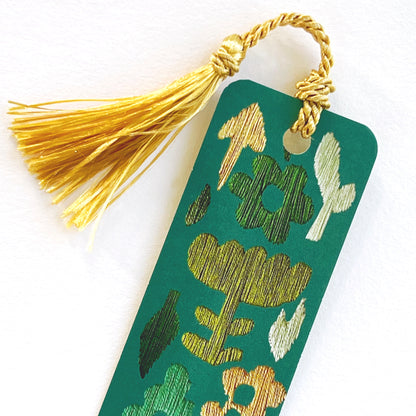 Gold tassel on green bookmark with embroidered flowers by Rikrack