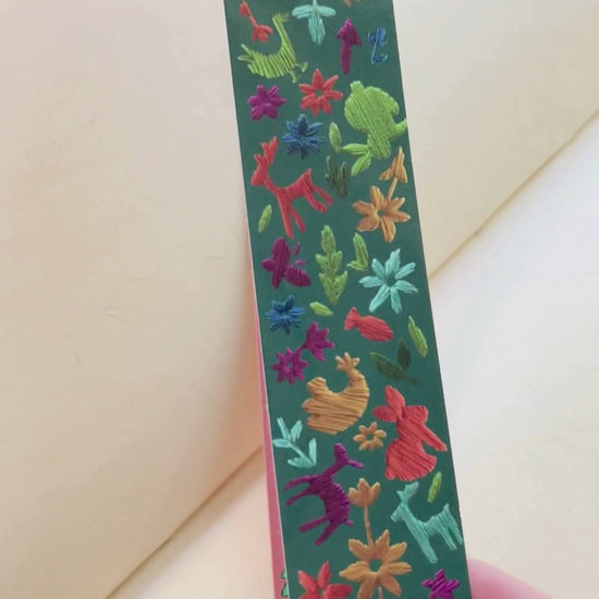 video of dark green bookmark with embroidered animals and flowers by Rikrack