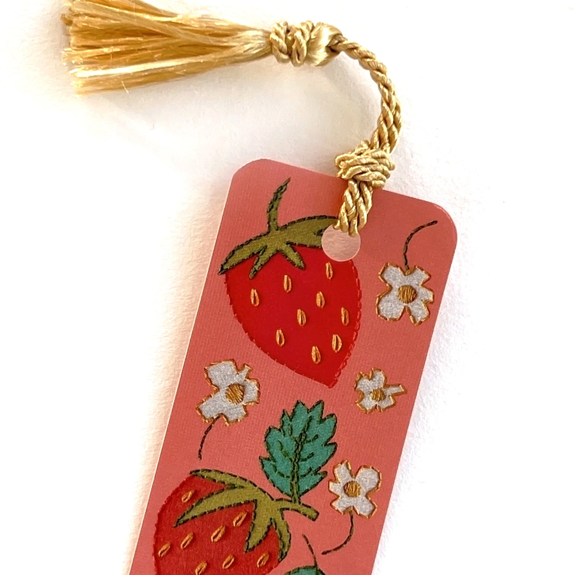 Gold tassel on 1.5x7 inch bubblegum pink bookmark with realistic stitching of embroidered strawberries by Rikrack